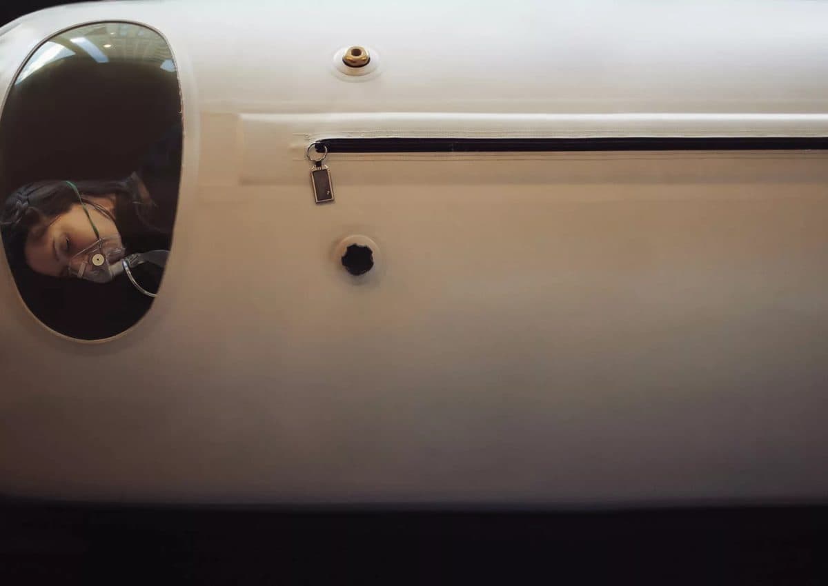 The sealed porthole door of a hyperbaric oxygen chamber
