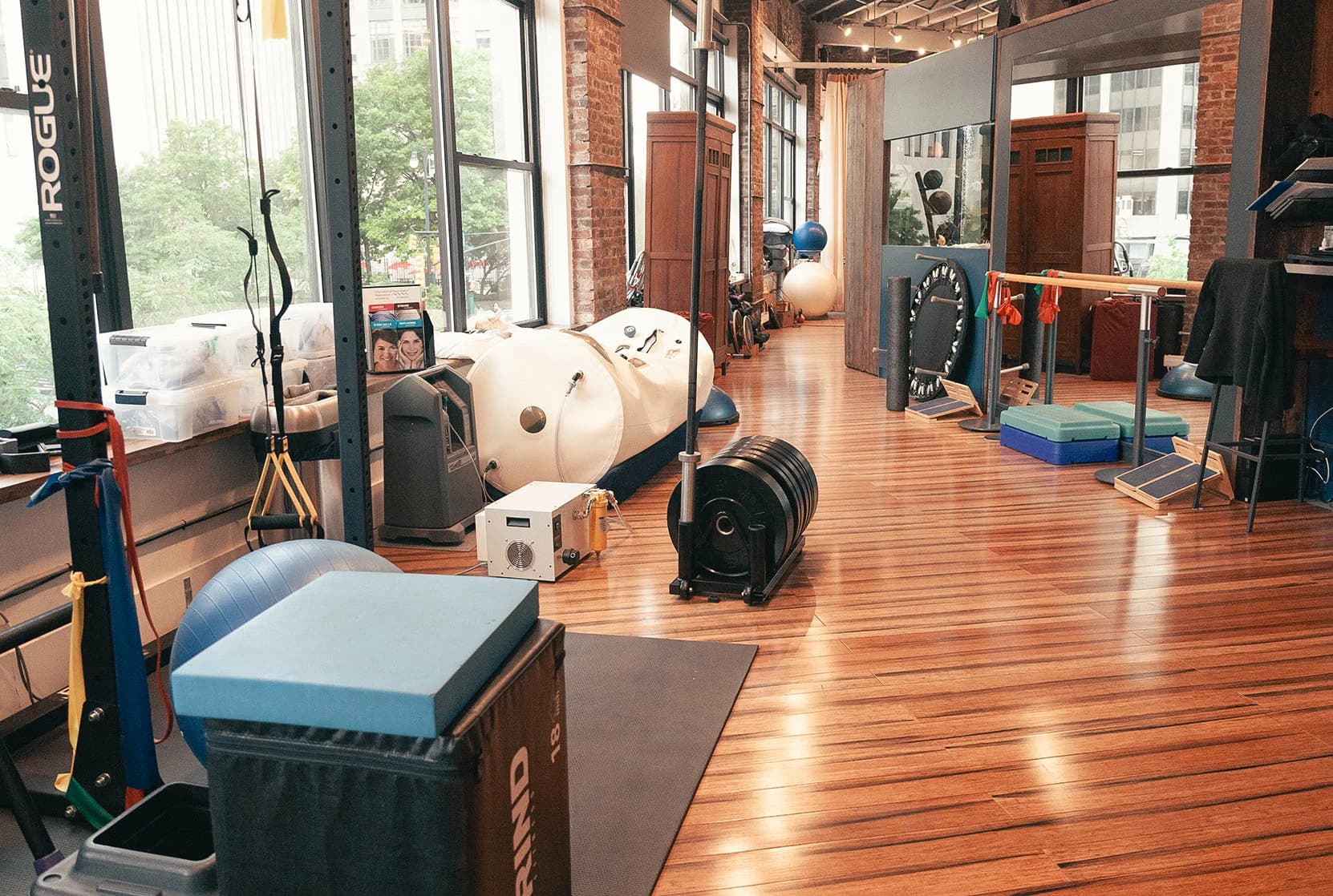 Physio Logic's exercise studio with equipment beside the windows