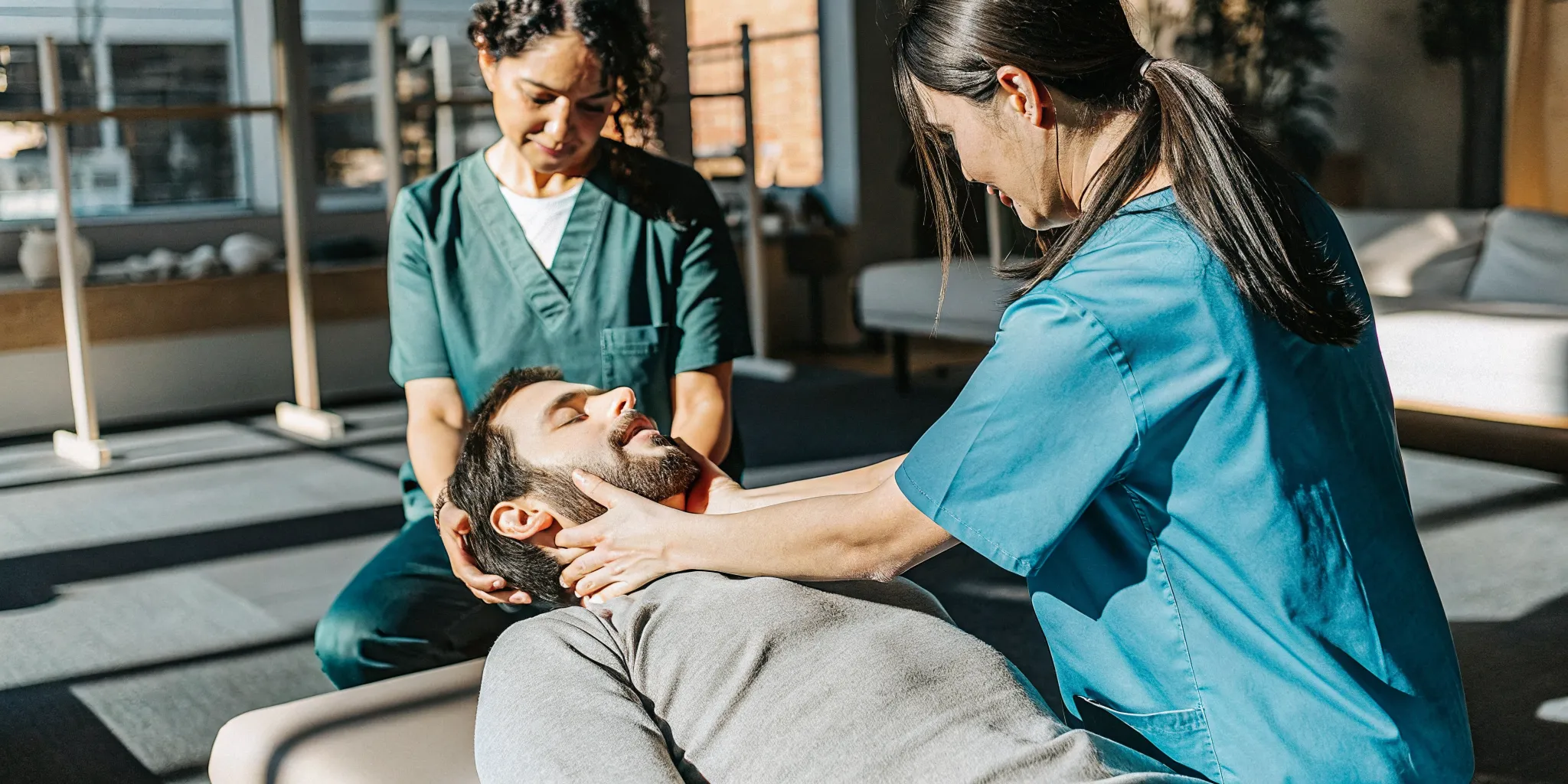 Neck stretching exercise guided by a physical therapist for neck pain recovery in Brooklyn