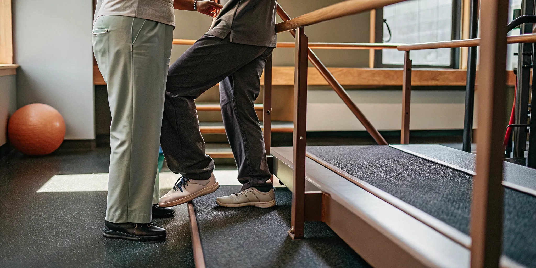 Physical therapist guiding a patient through a vestibular balance exercise